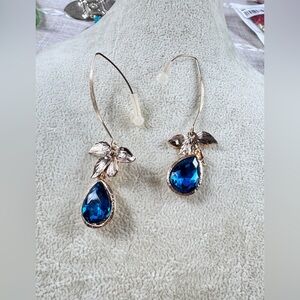 Elegant Blue Orchid Stone Teardrop Earrings with Gold Accents